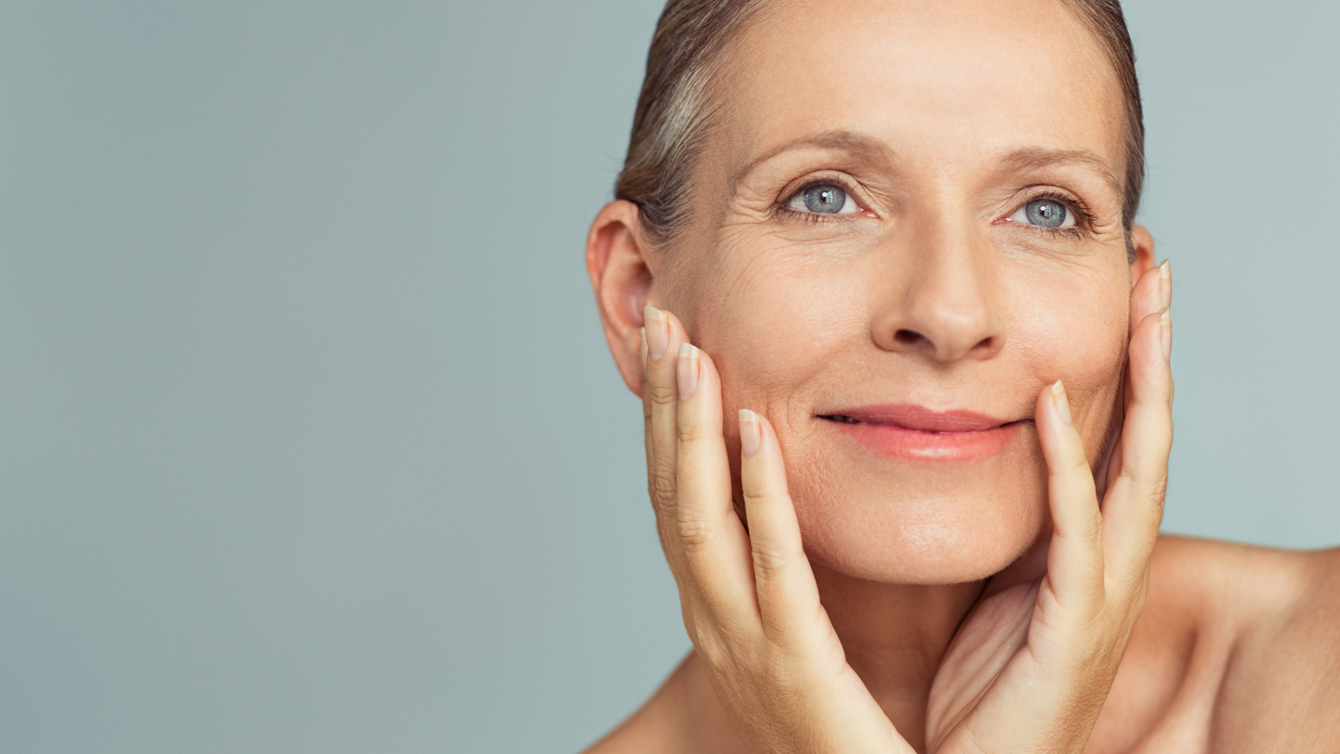 Woman gently touching face with eyes closed, representing skin health and non-surgical treatments in Mildura, Victoria.